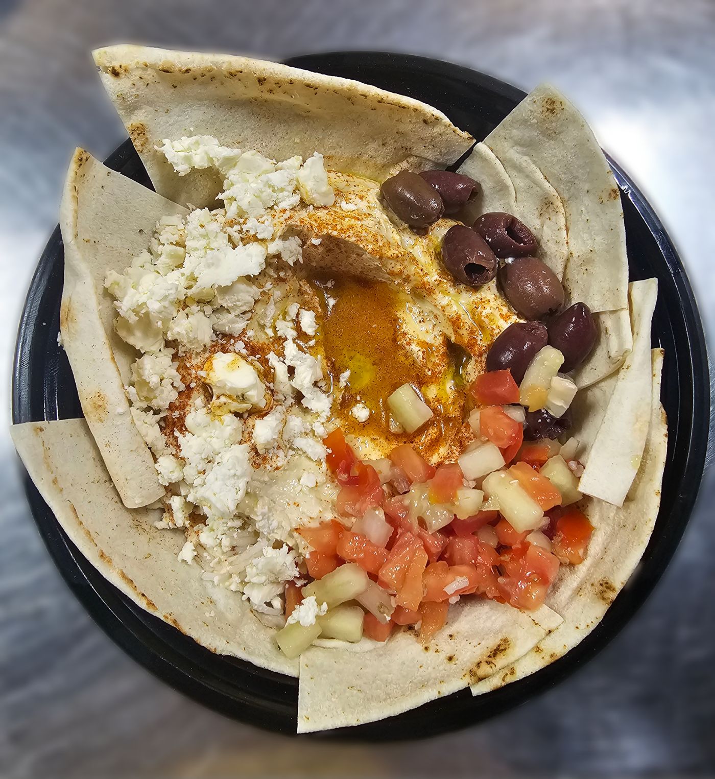 Hummus with feta, olives and medley
